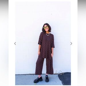 Dressed in Lala Lex Ribbed Checkerboard Playsuit in Black + Mocha